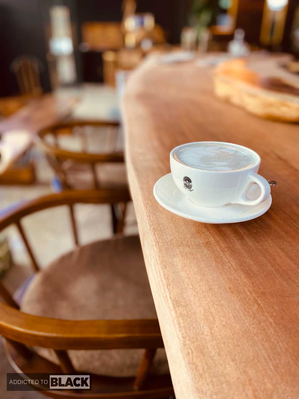 coffee cup on mahogany table